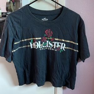 Black Hollister T-shirt with red roses on it.